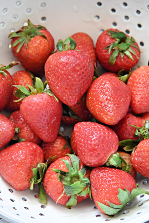 strawberries in a collander