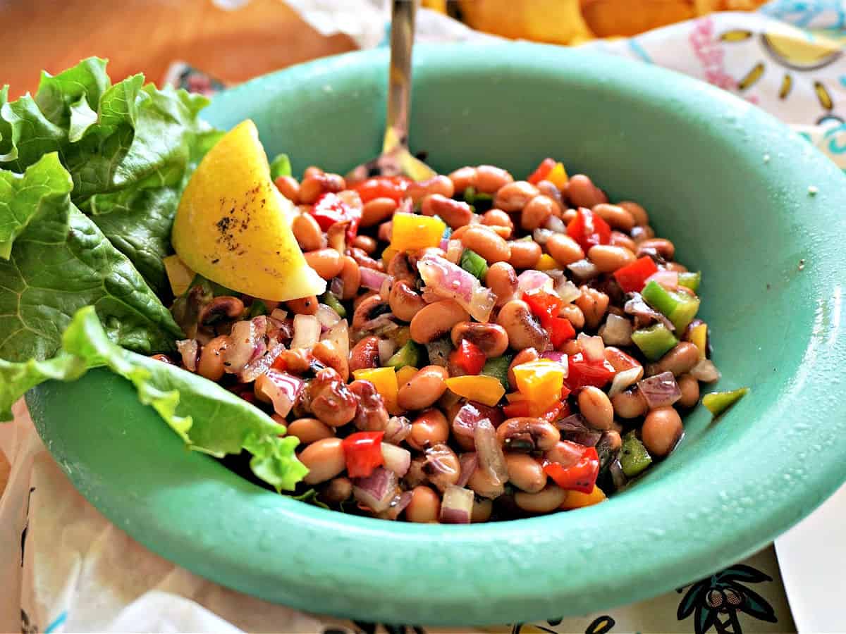 LuLu’s L.A. Caviar made with black-eyed peas, diced bell peppers, and red onion, served with lettuce and a lemon wedge.