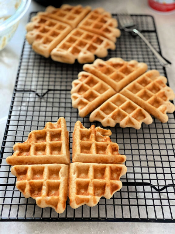 waffles cooling on a wire rack