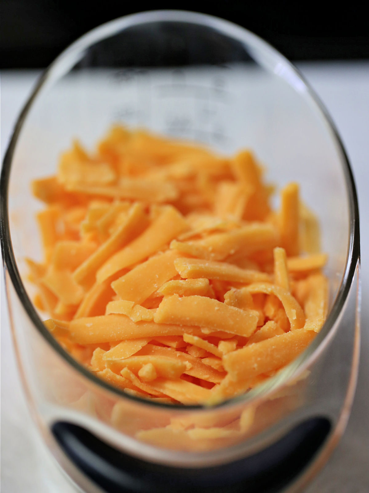 Cup of cheddar cheese.