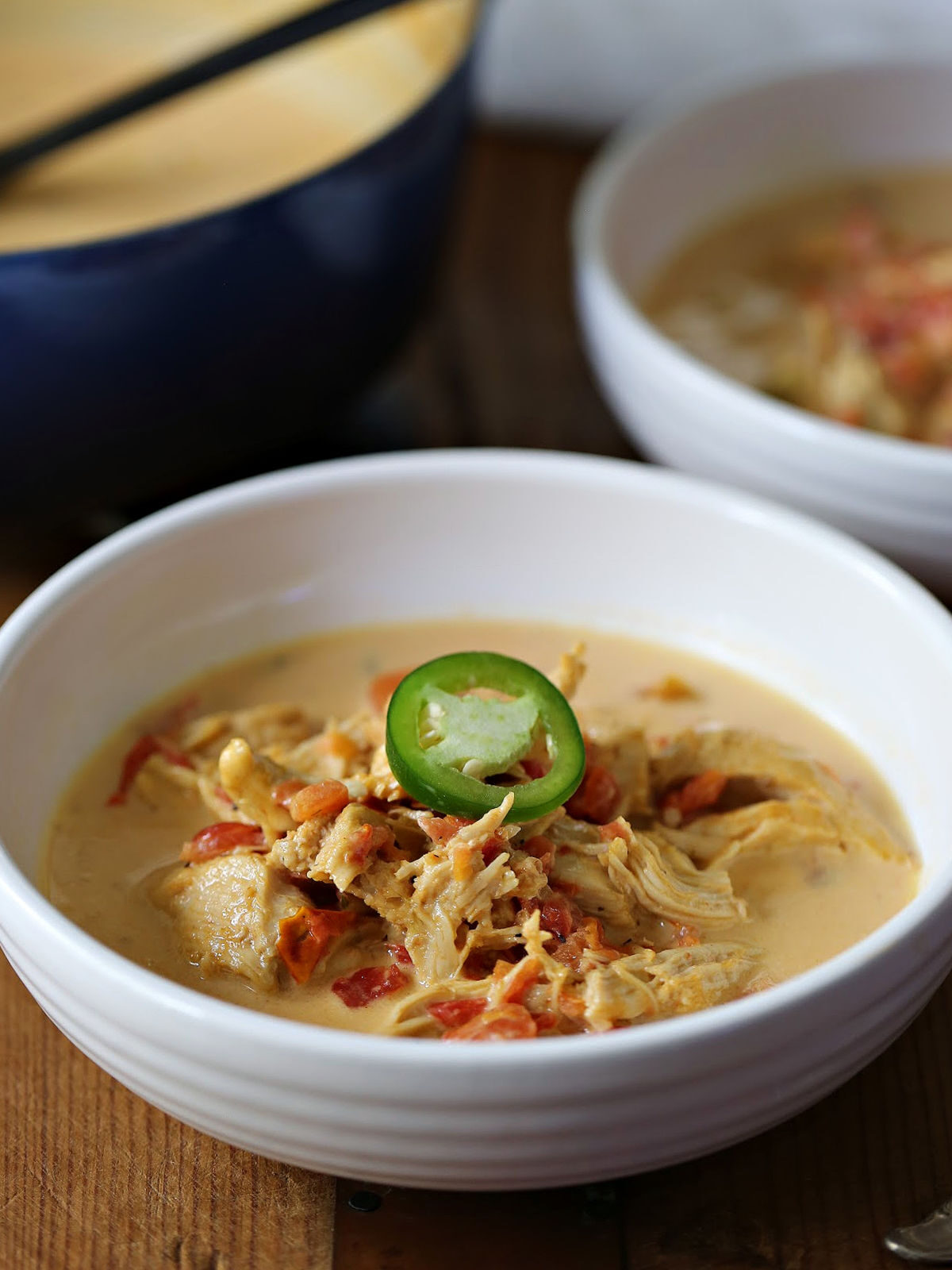 Bowl of chicken soup made with whipping cream, RoTel, and cheese.