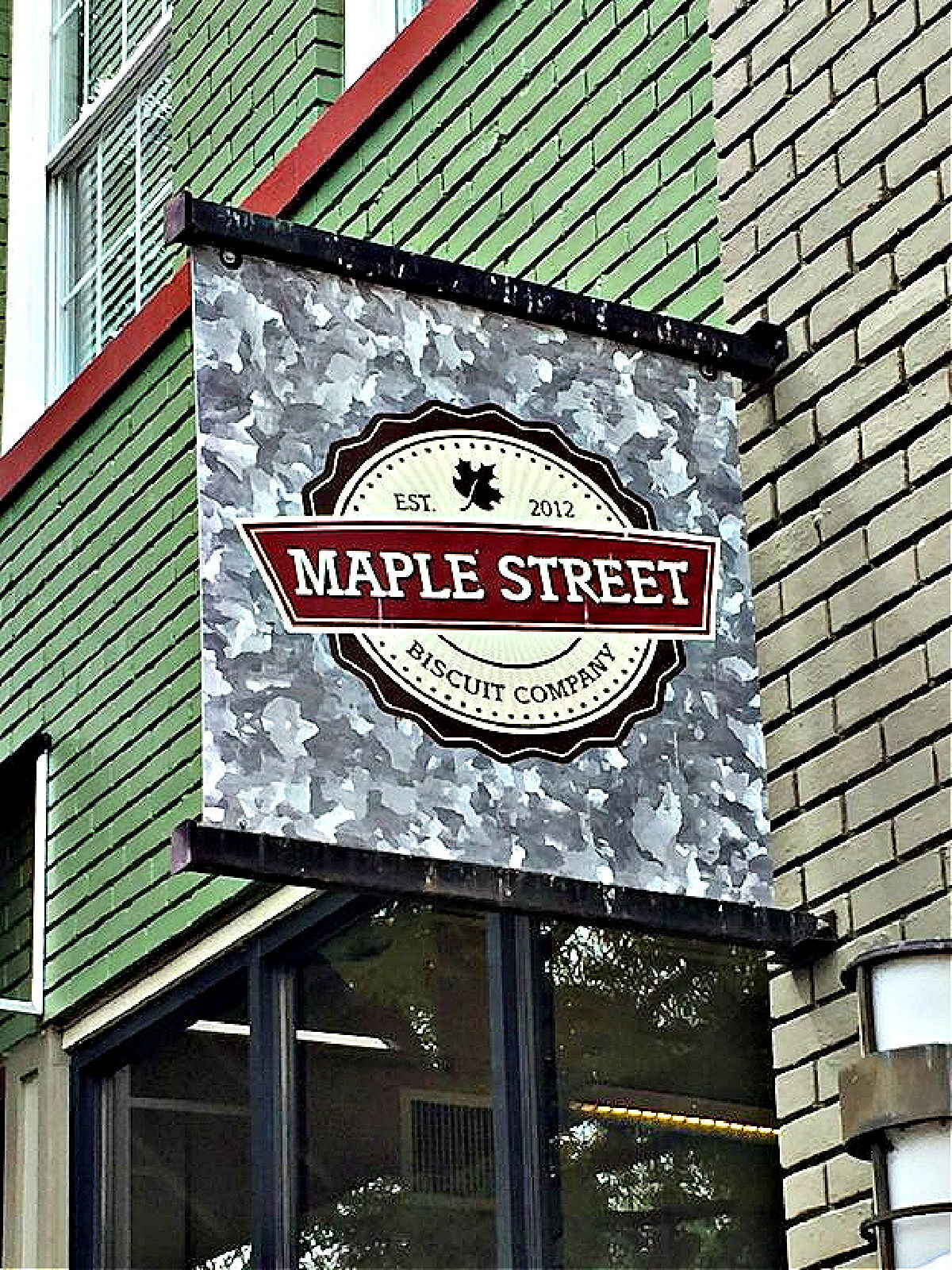 Maple Street Biscuit Company Maple Street Biscuit Company sign on building.