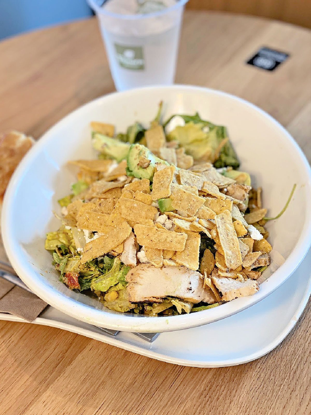 Panera Bread's Southwest Salad and French bread on a table.