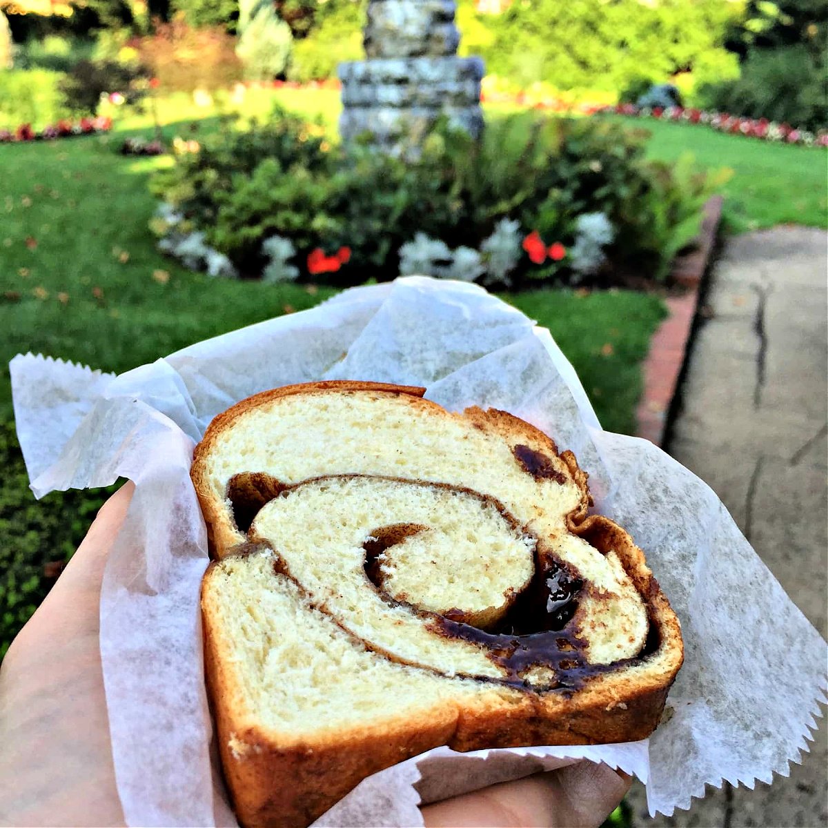 Where To Eat in Pittsburgh Slice of fresh baked cinnamon bread on parchment paper.