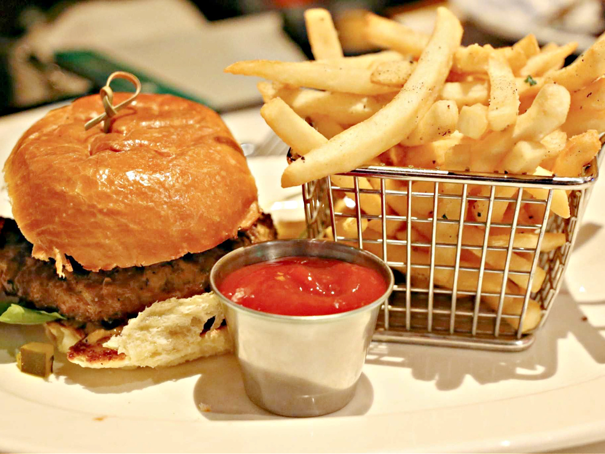 Where To Eat in Pittsburgh Platter with hamburger, a basket of French fries, and a cup of catsup.