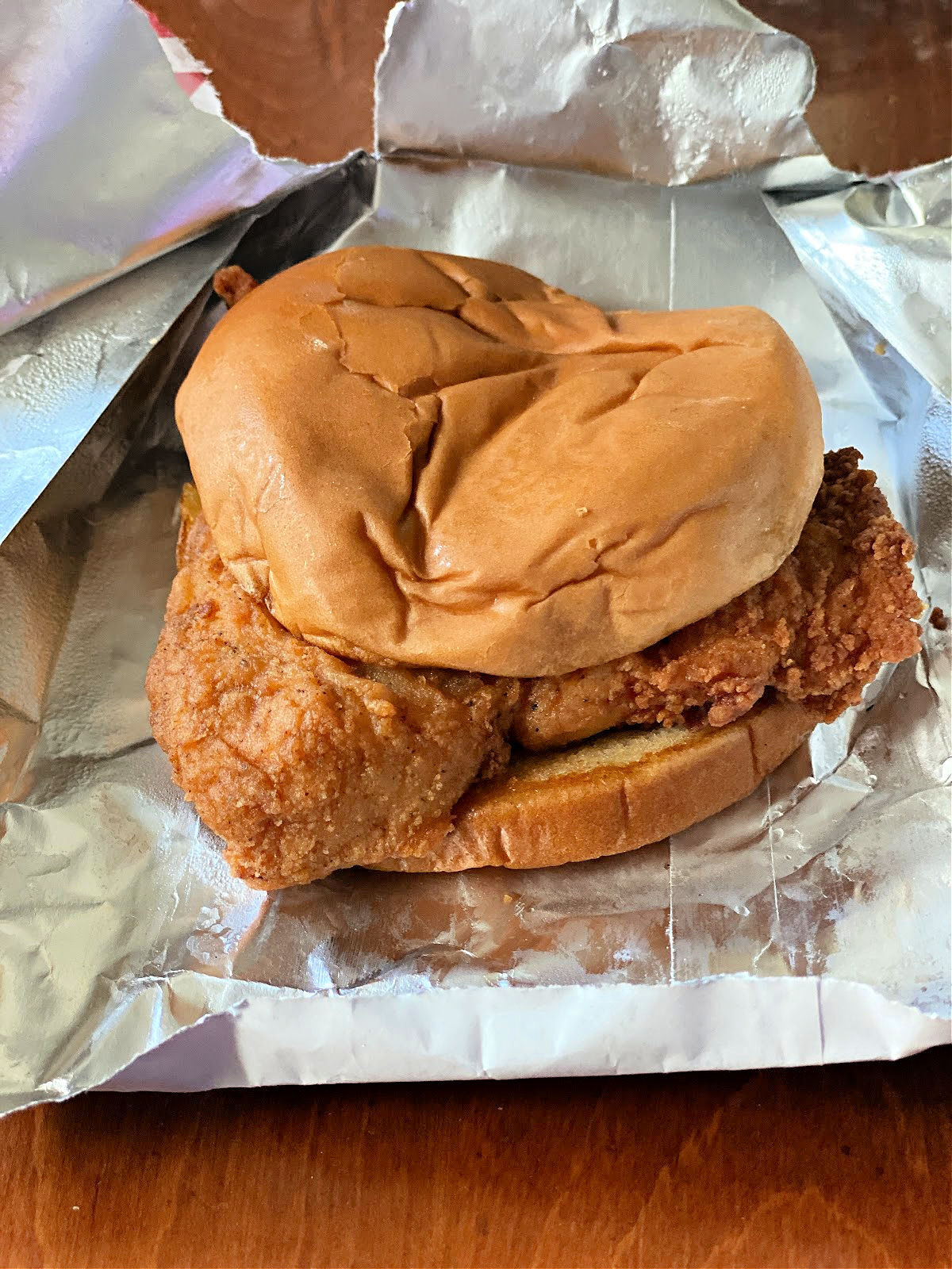 Classic Chick-Fil-A sandwich sitting on its wrapper.