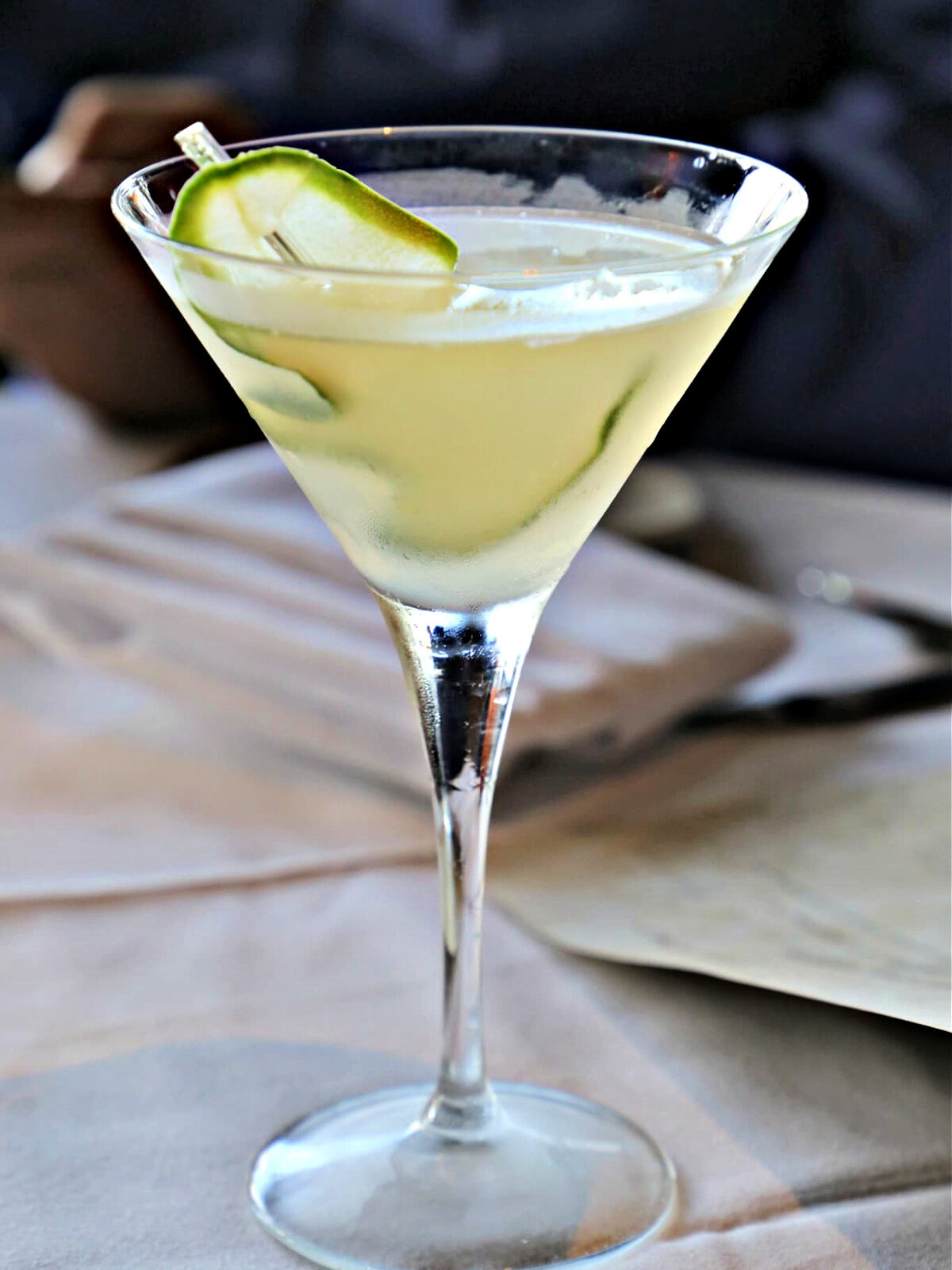Where To Eat in Pittsburgh Cucumber martini in a martini glass with cucumber slice.