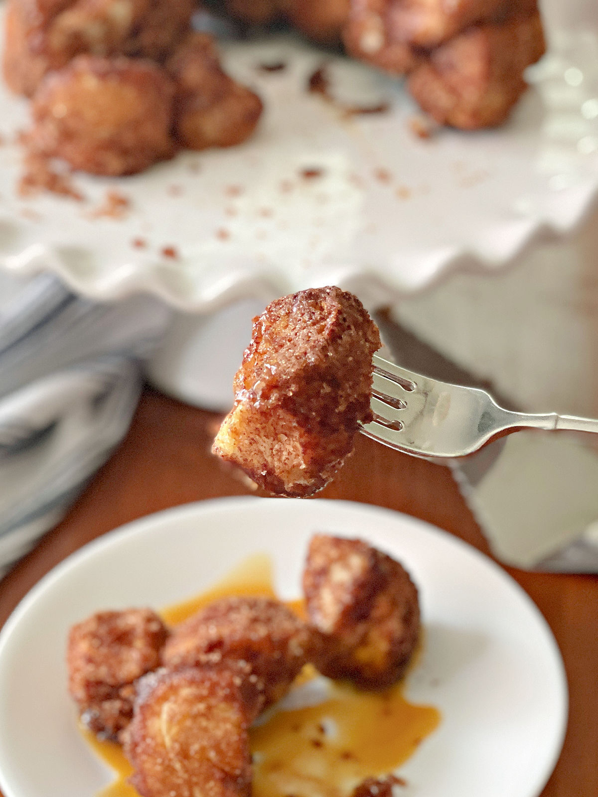 Silver fork holding a piece of monkey bread.