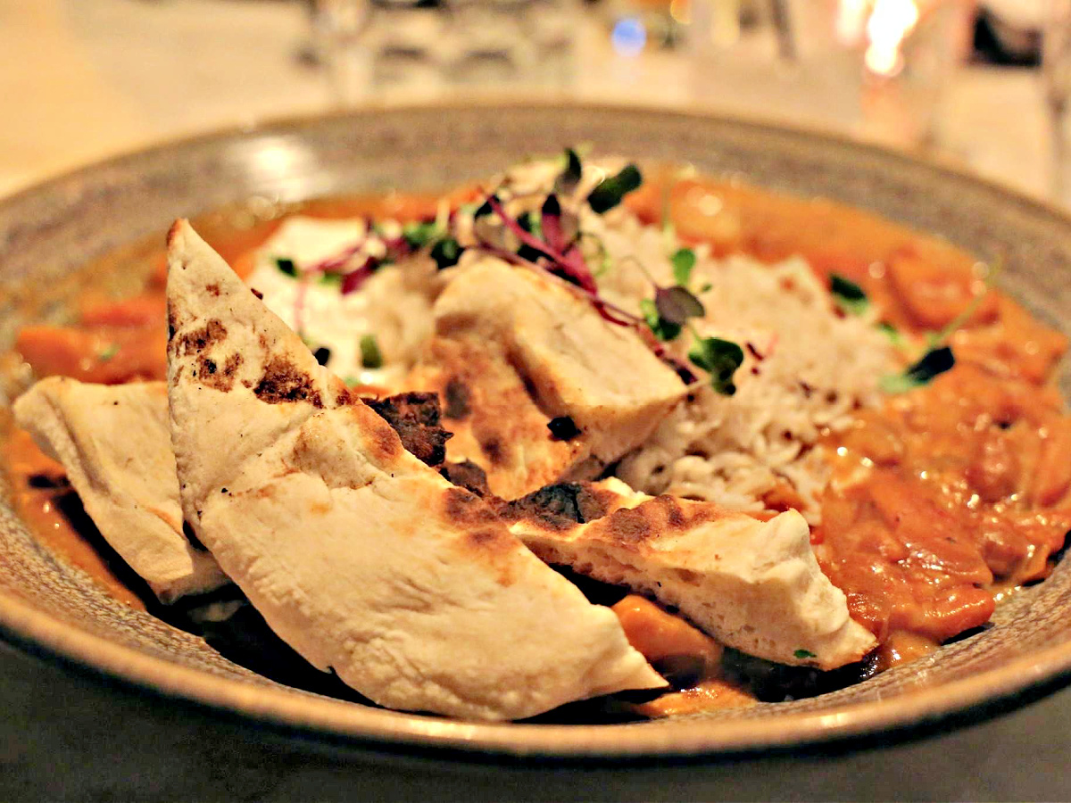 Where To Eat in Pittsburgh Plate of Vegetarian Tikka Masala served with naan.