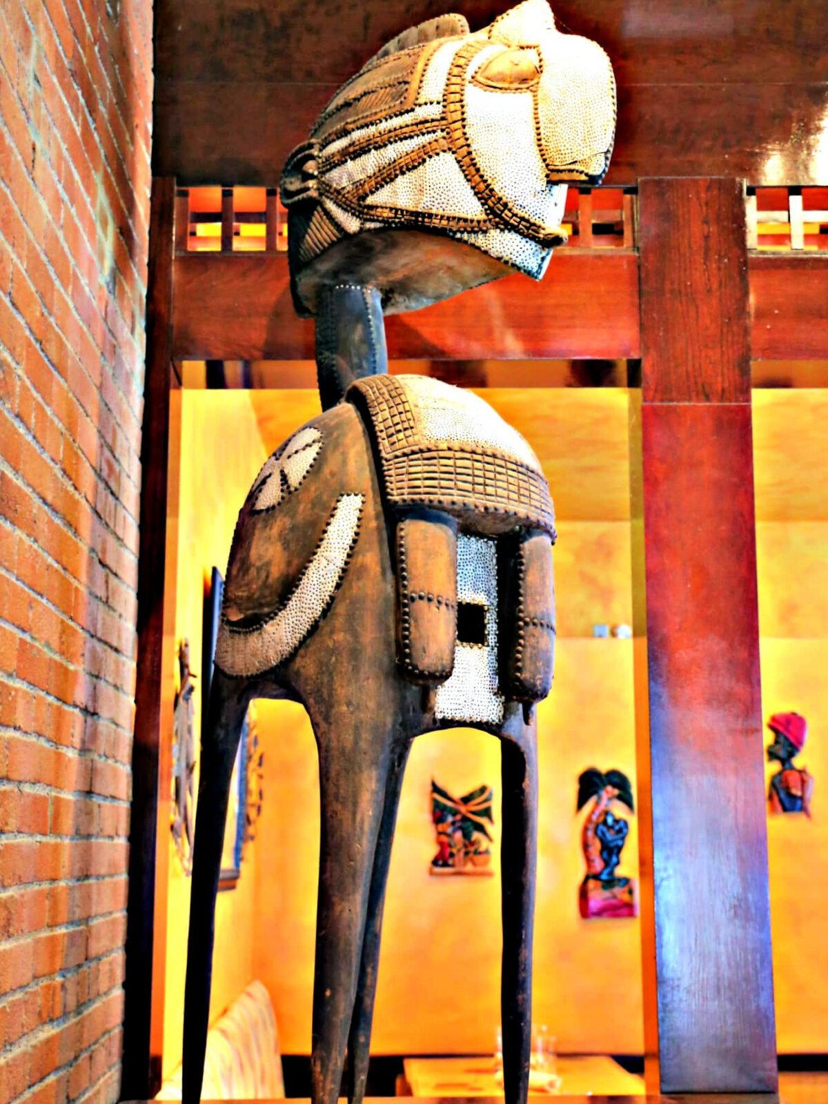Where To Eat in Pittsburgh Latin sculpture with four legs inside a restaurant.