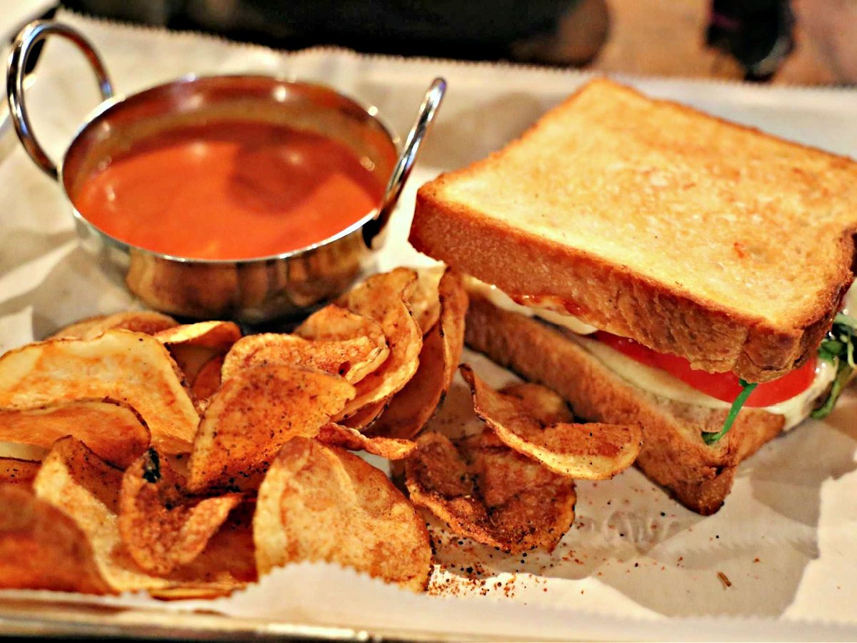 Where To Eat in Pittsburgh Caprese grilled cheese sandwich with mozzarella cheese and basil with homemade chips.