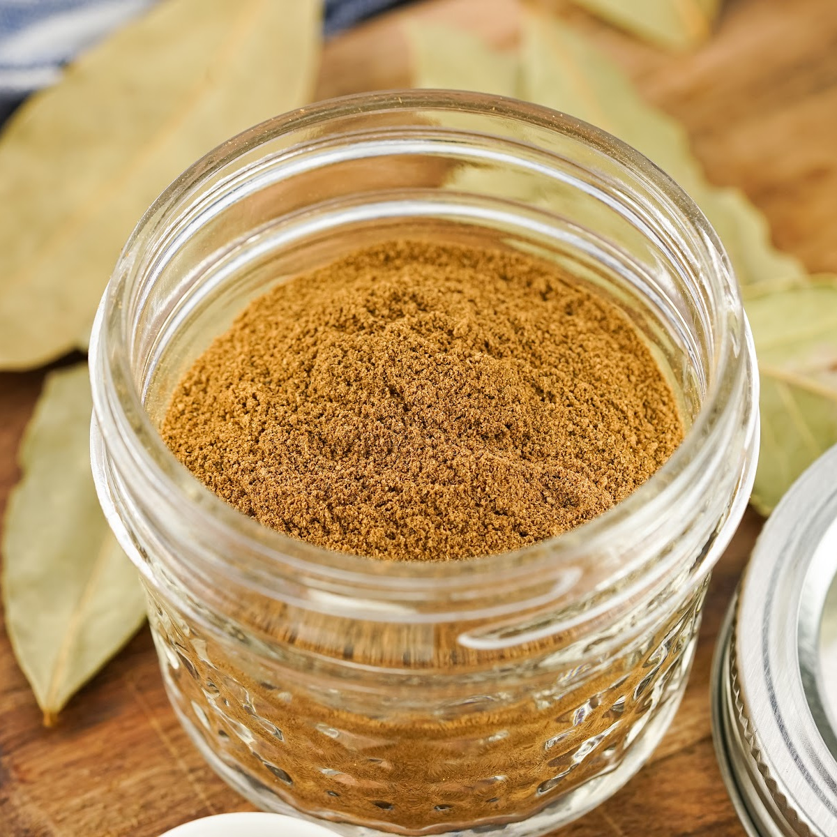 Small glass jar with apple pie spice.
