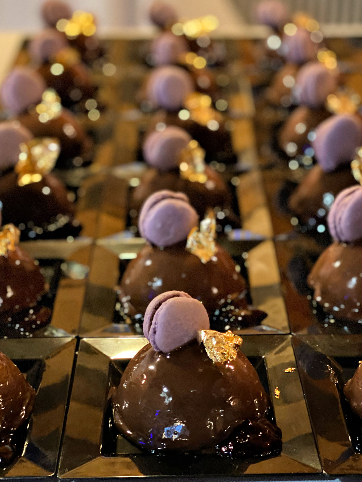 Black Beauty desserts topped with purple macaroon.