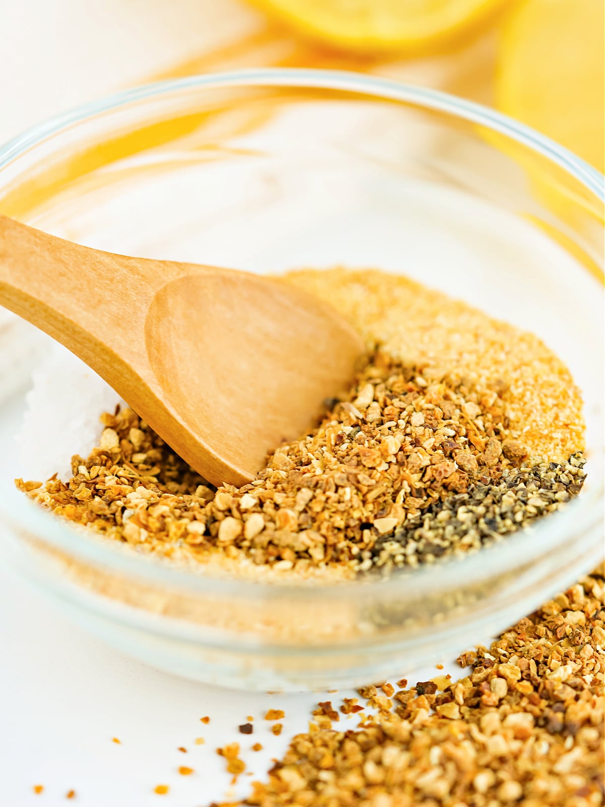 Lemon pepper seasoning ingredients being mixed in a small bowl.