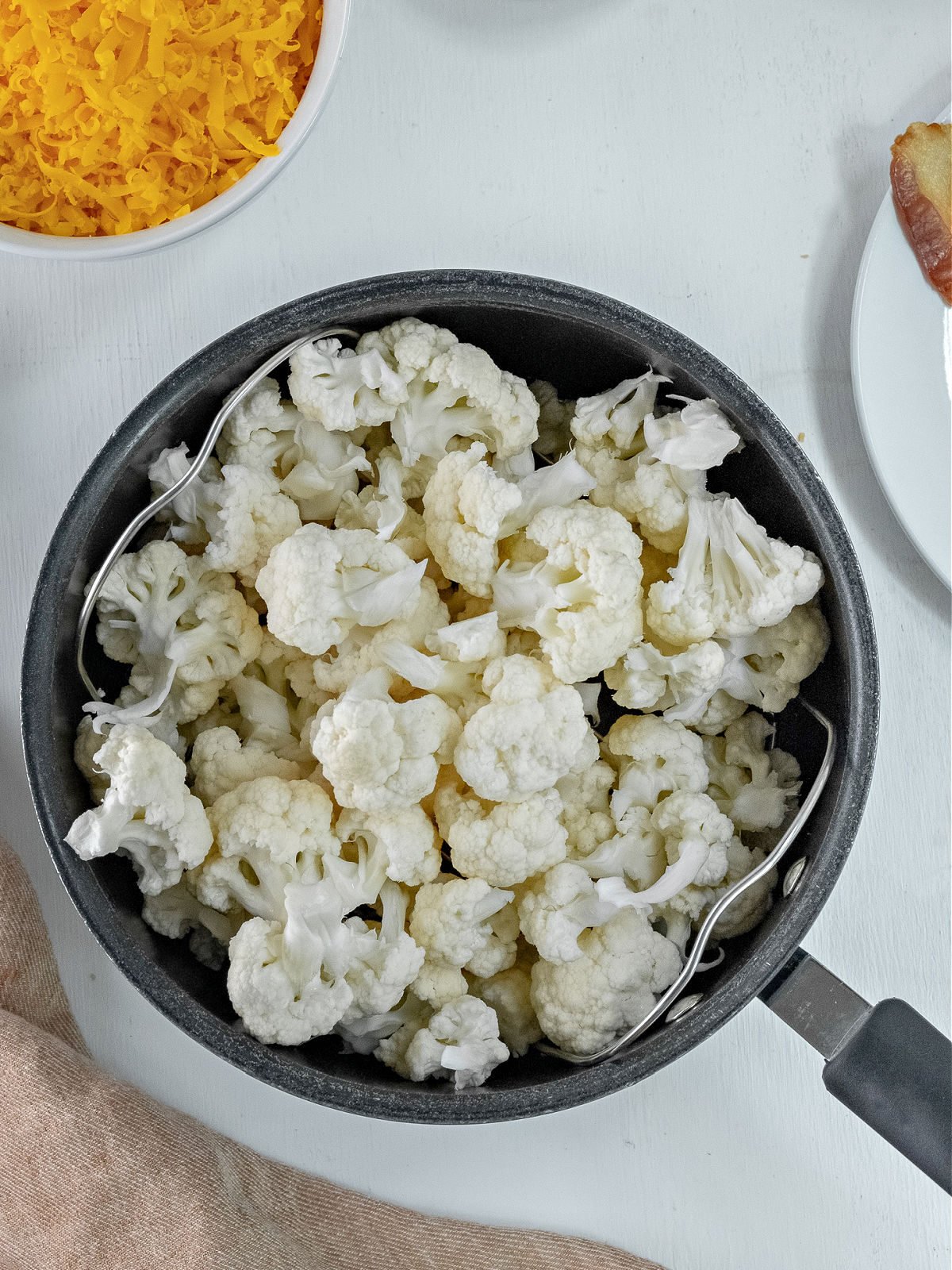 Pot filled with cauliflower florets.