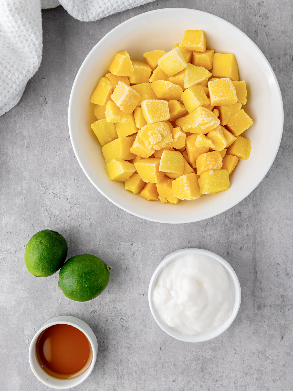 Chunks of mango, a couple of limes, maple syrup, and coconut milk.