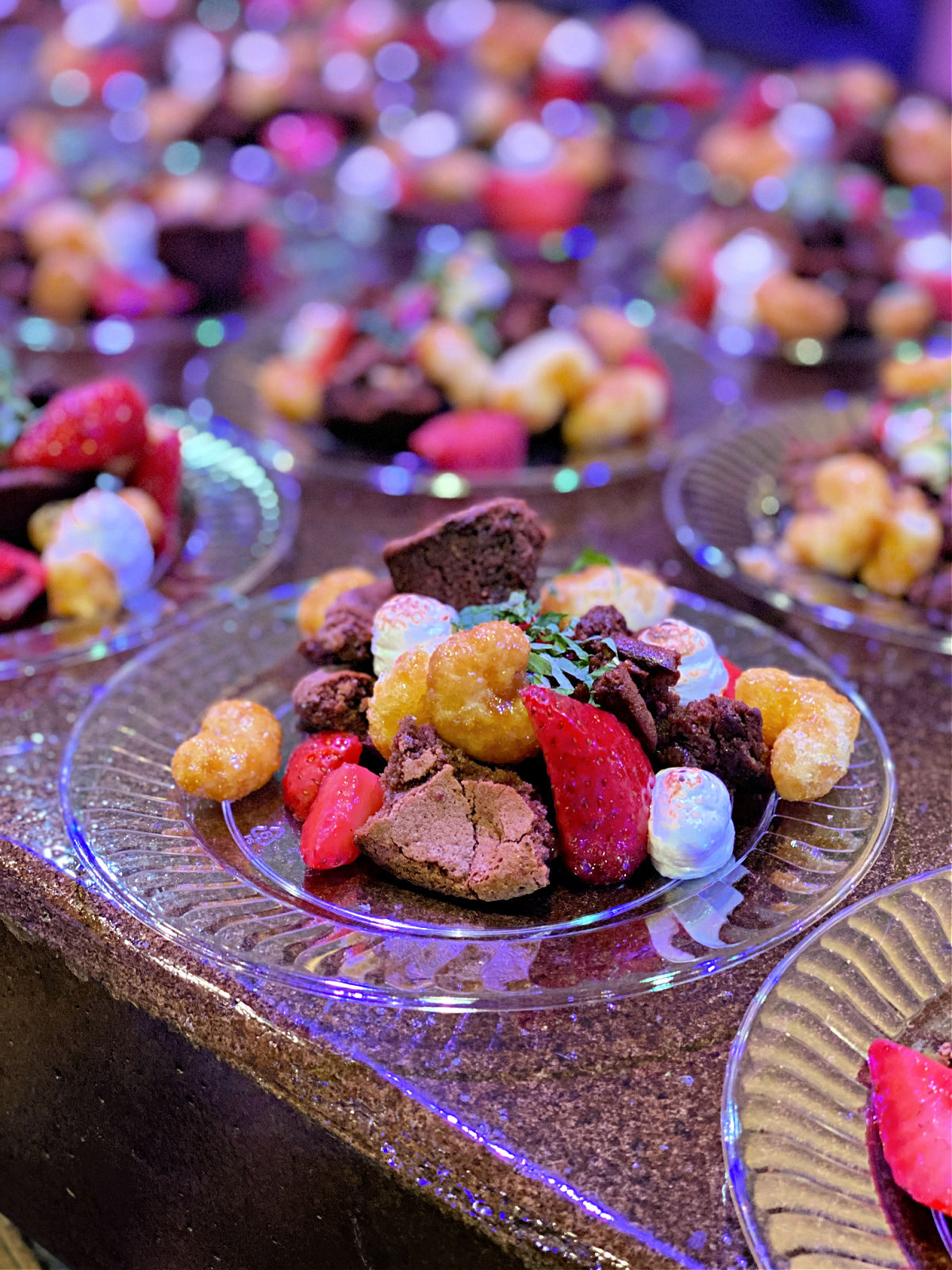 Sweet Heat Masa Brownie and Mezcal Meringue with Strawberries and Corn Crunch on plates.