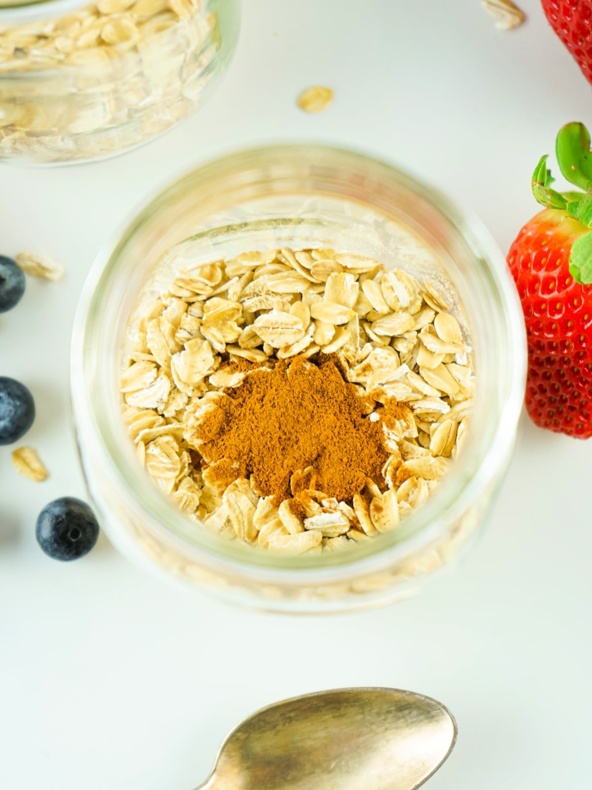 Oats and cinnamon in a glass jar.