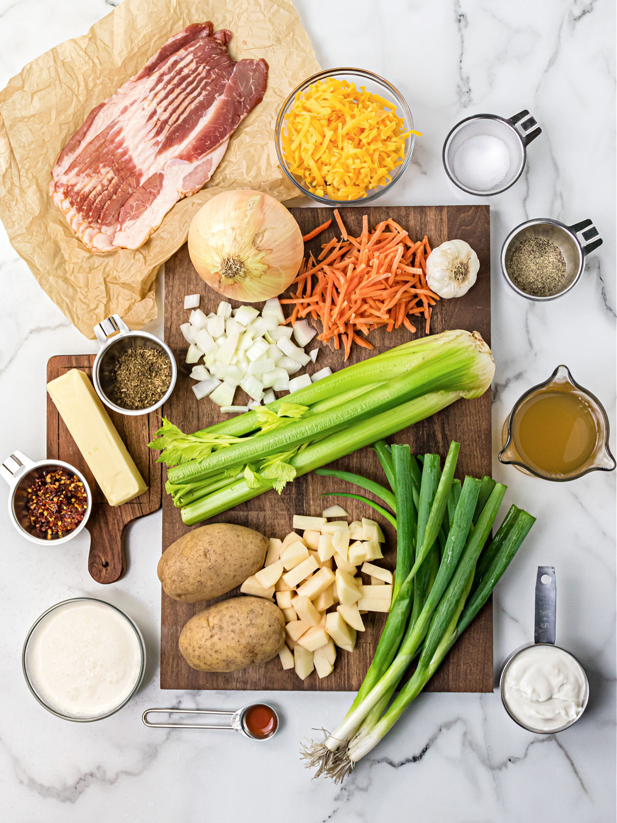 Bacon, butter, celery, green onions, potatoes, carrots and spices.