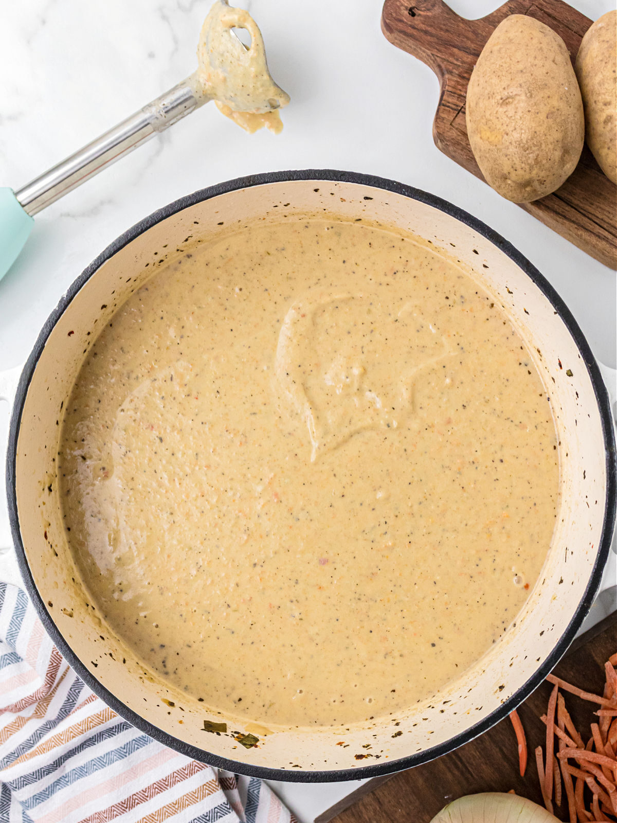 Pureed potato soup in a pot.