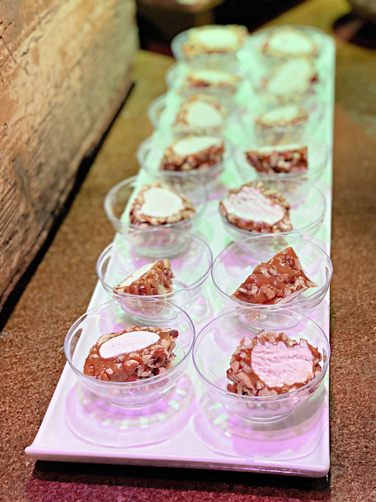 Slices of pecan log in small dessert cups.