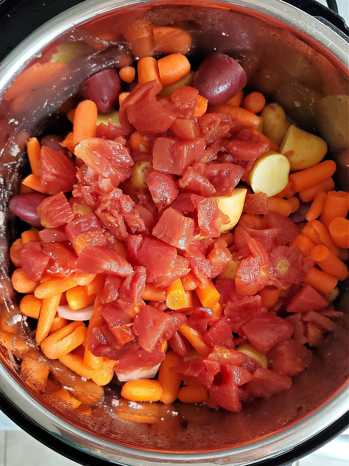 Vegetables and diced tomatoes in an Instant Pot.