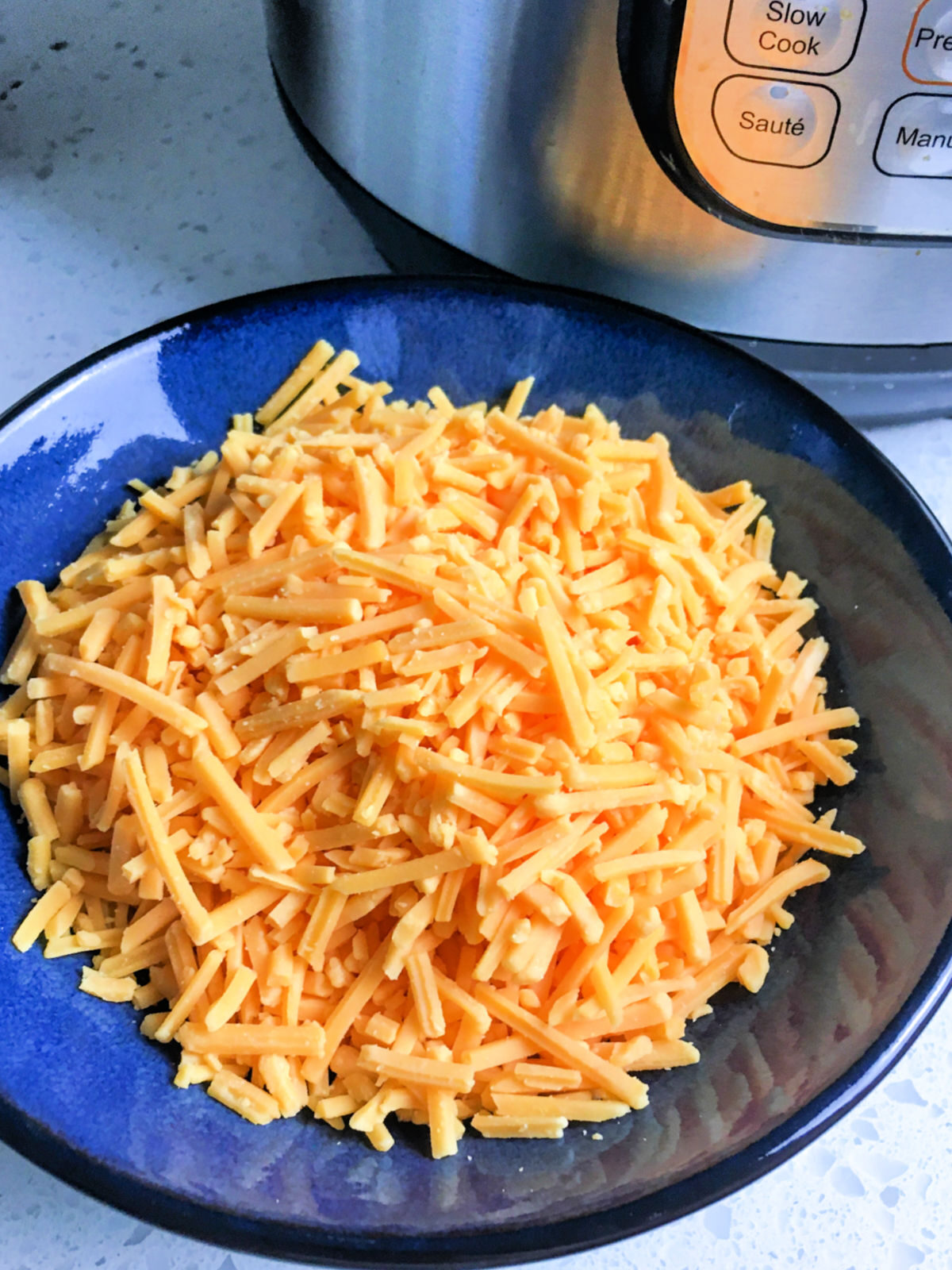 Blue plate with Cheddar cheese.