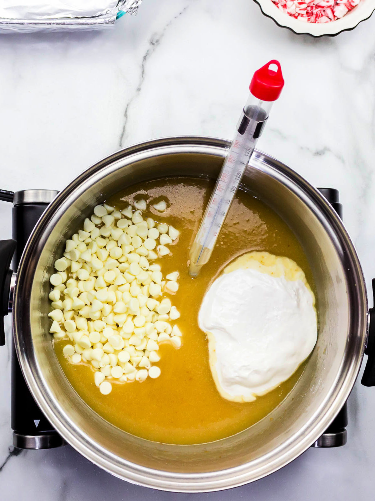 White chocolate and melted butter in a pot.