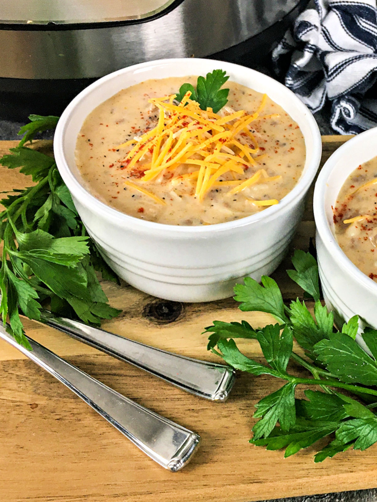 White bowls filled with cheeseburger soup.