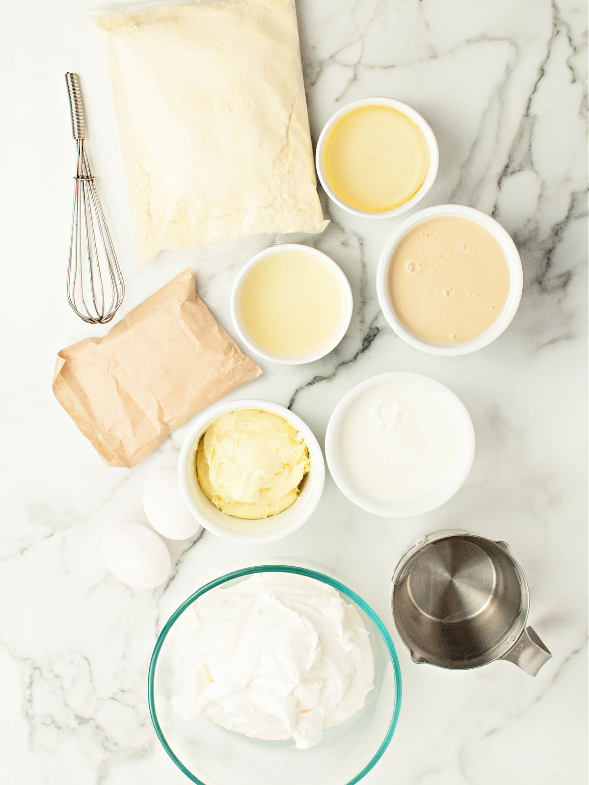 Ingredients to make a lemon cake on a counter top.
