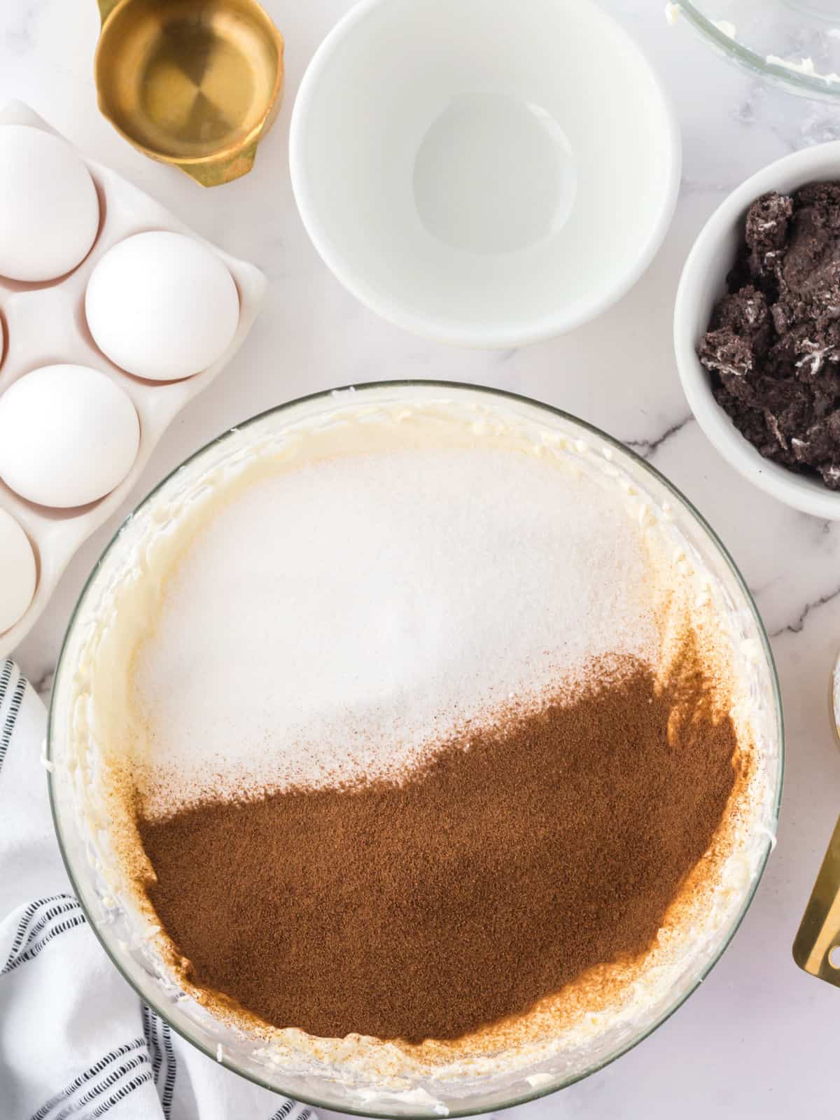 Instant coffee and sugar on top of whipped cream cheese.