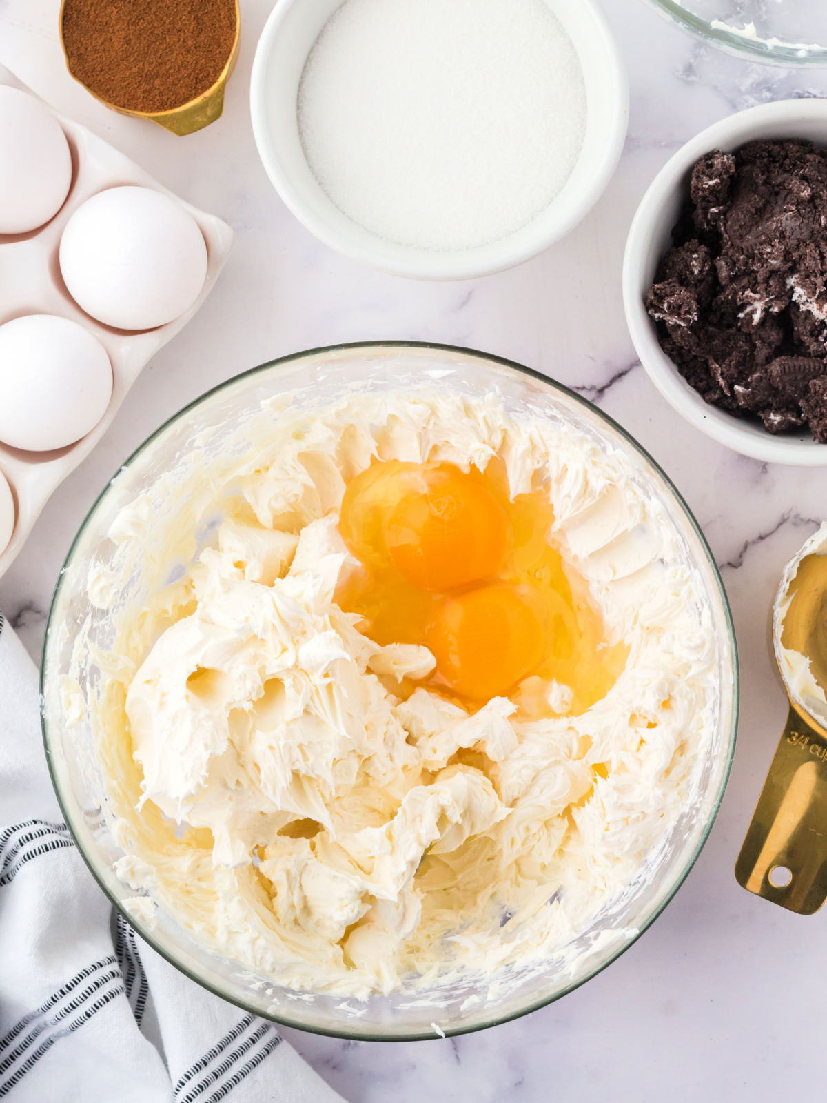 Whipped cream cheese and eggs in a bowl,