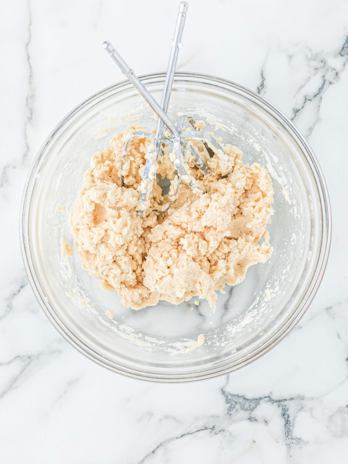 Pie crust in a glass mixing bowl.