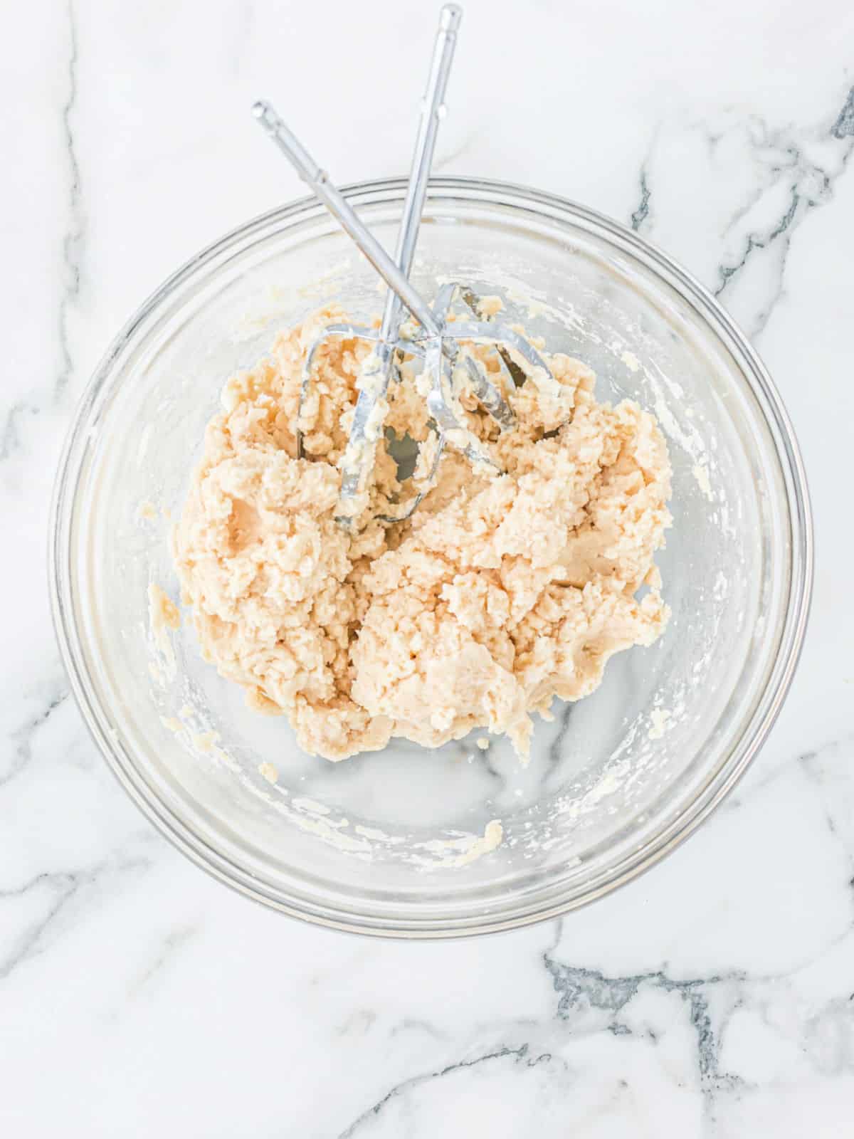Pie crust in a glass mixing bowl.
