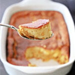 Scoop pf corn pudding on a spoon.