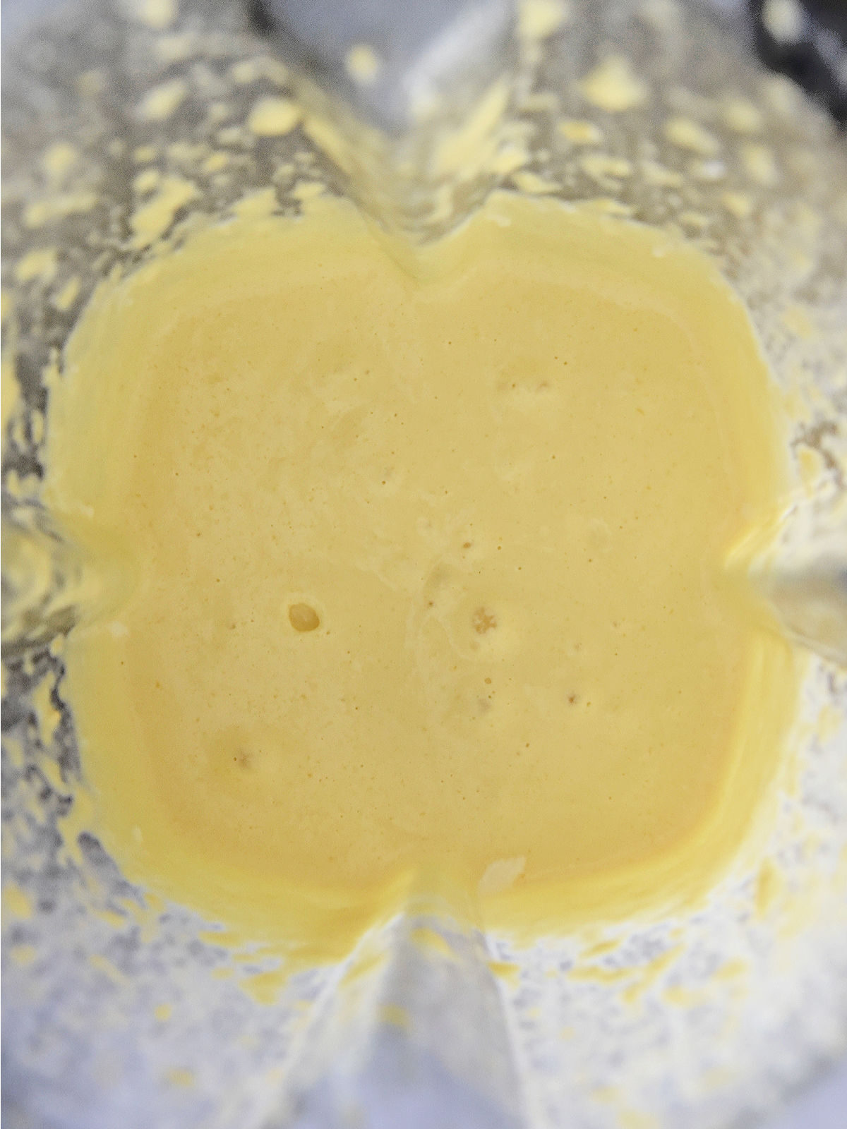 Corn and heavy cream blended in a blender.