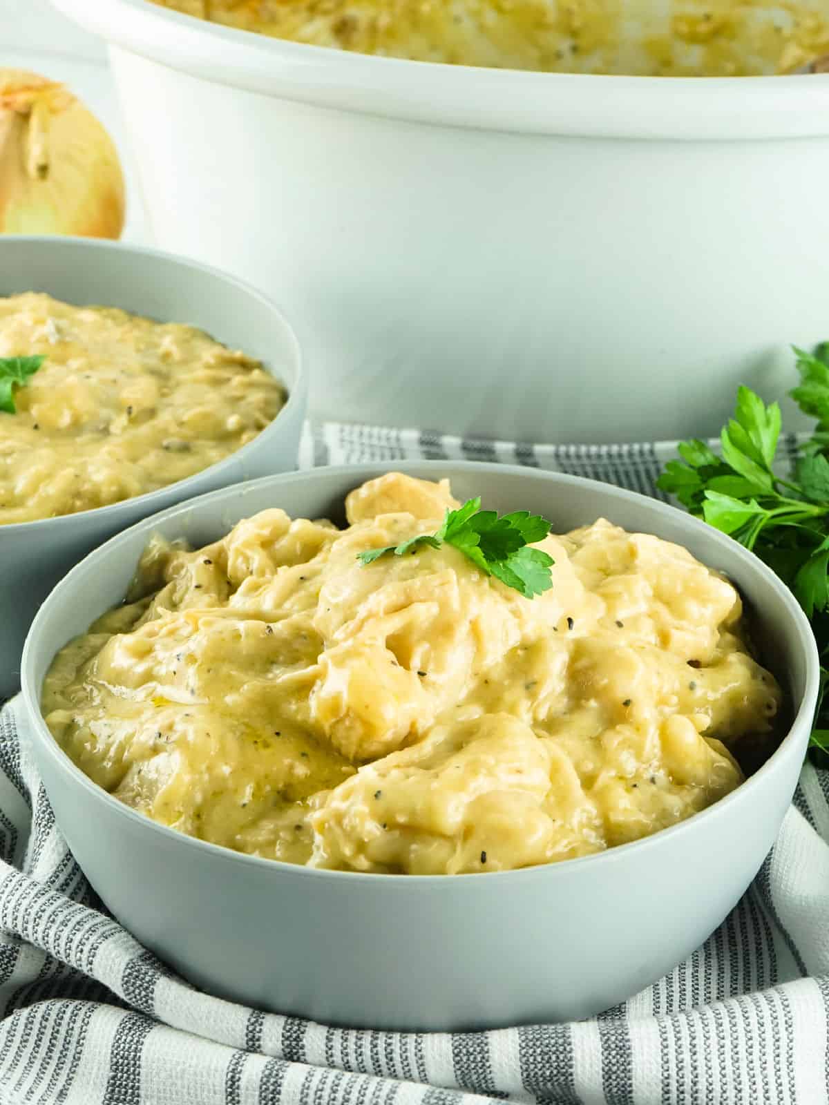 Bowl of chicken and dumplings made in a CrockPot.