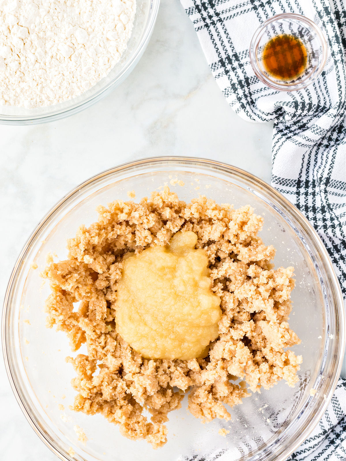 Apple sauce on top of creamed sugar mixture.