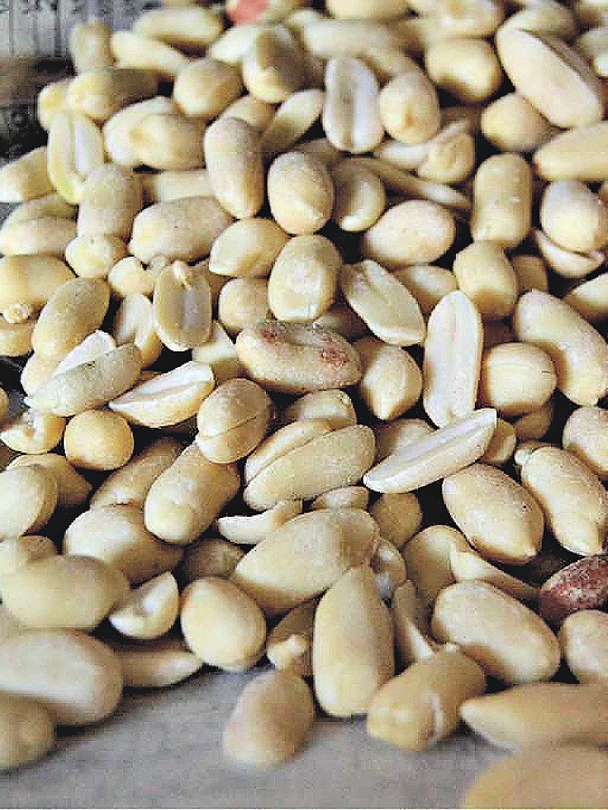 Peanuts spilling out onto a counter top.