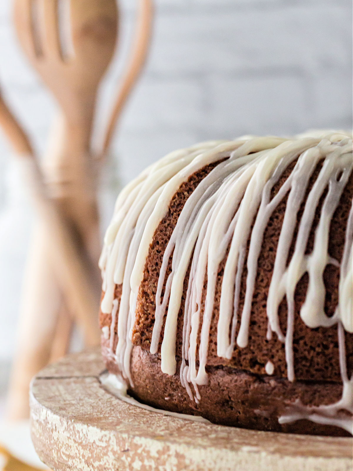 Red velvet cake topped with white glaze.