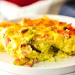 Breakfast casserole on a stack of plates.