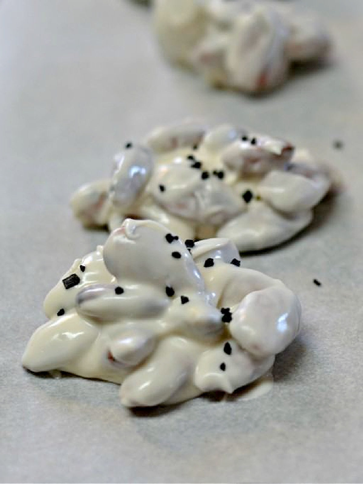 Almonds coated in white chocolate and topped with black sea salt.