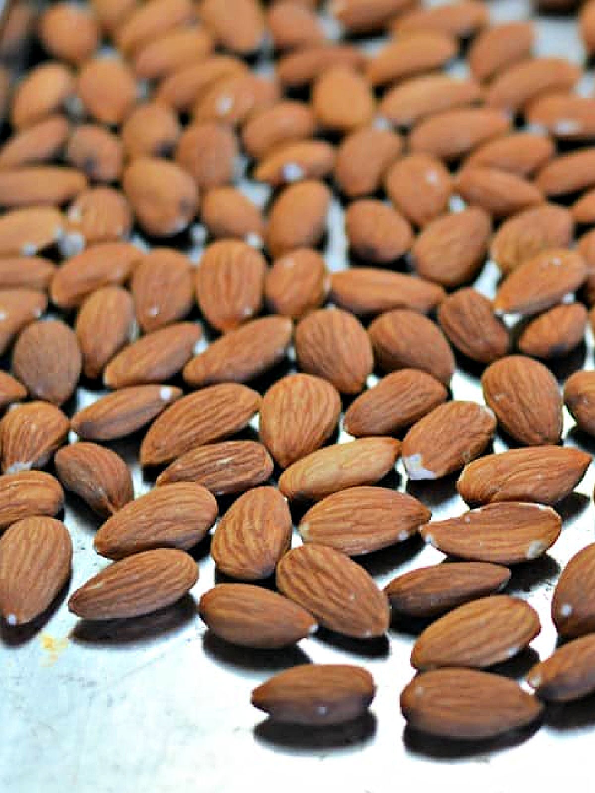 Almonds on a baking sheet.