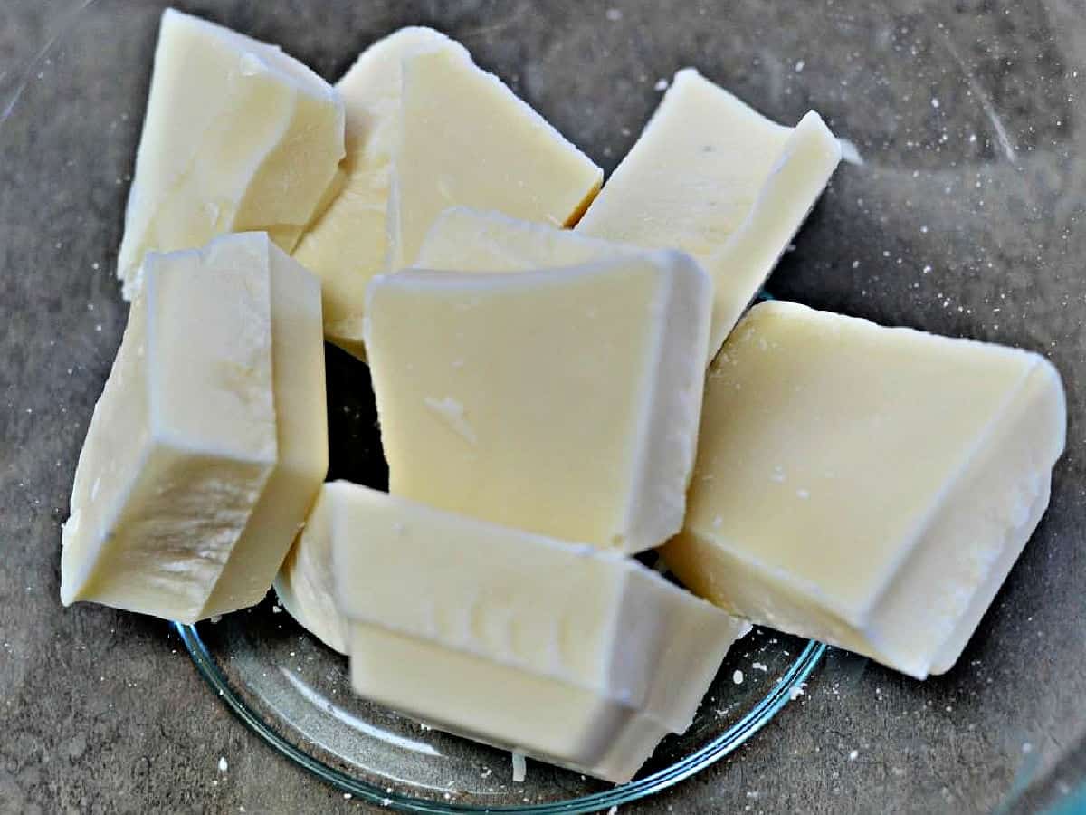 White almond bark blocks in a glass bowl.