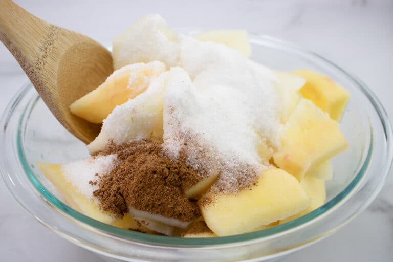 tossing apples in sugar