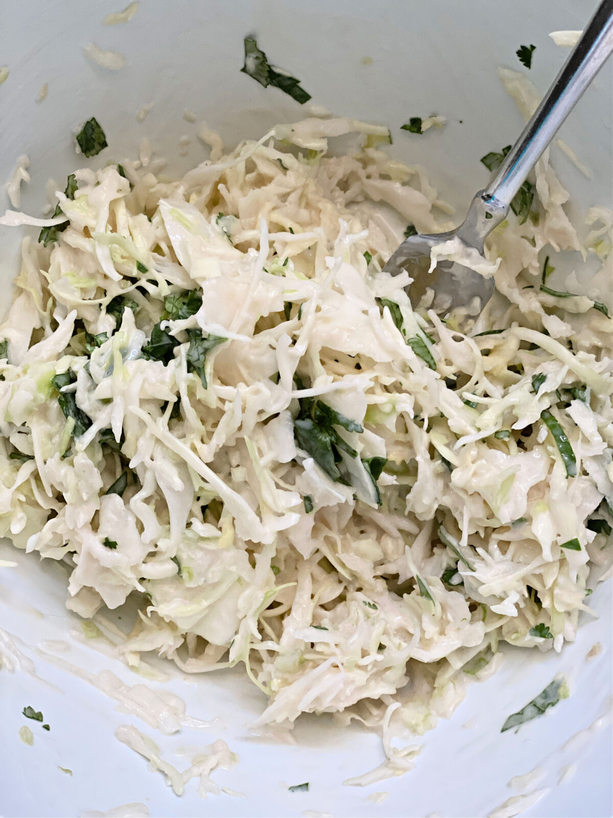 Cilantro and shredded cabbage tossed in Greek yogurt dressing.