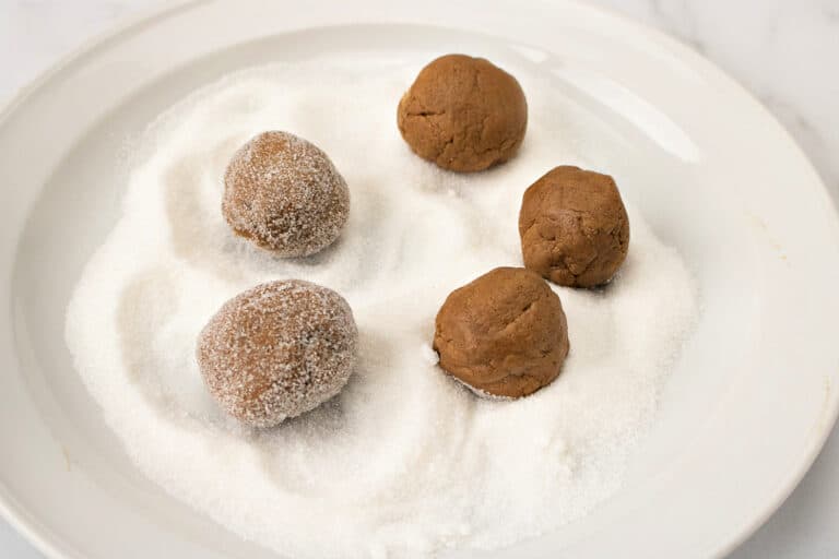 rolling cookies in sugar