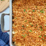 Baked hash brown casserole topped with chopped chives.