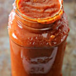 Jar of tomato curry sauce.