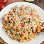 Mexican Street Corn Salad on a plate and garnished with cilantro.